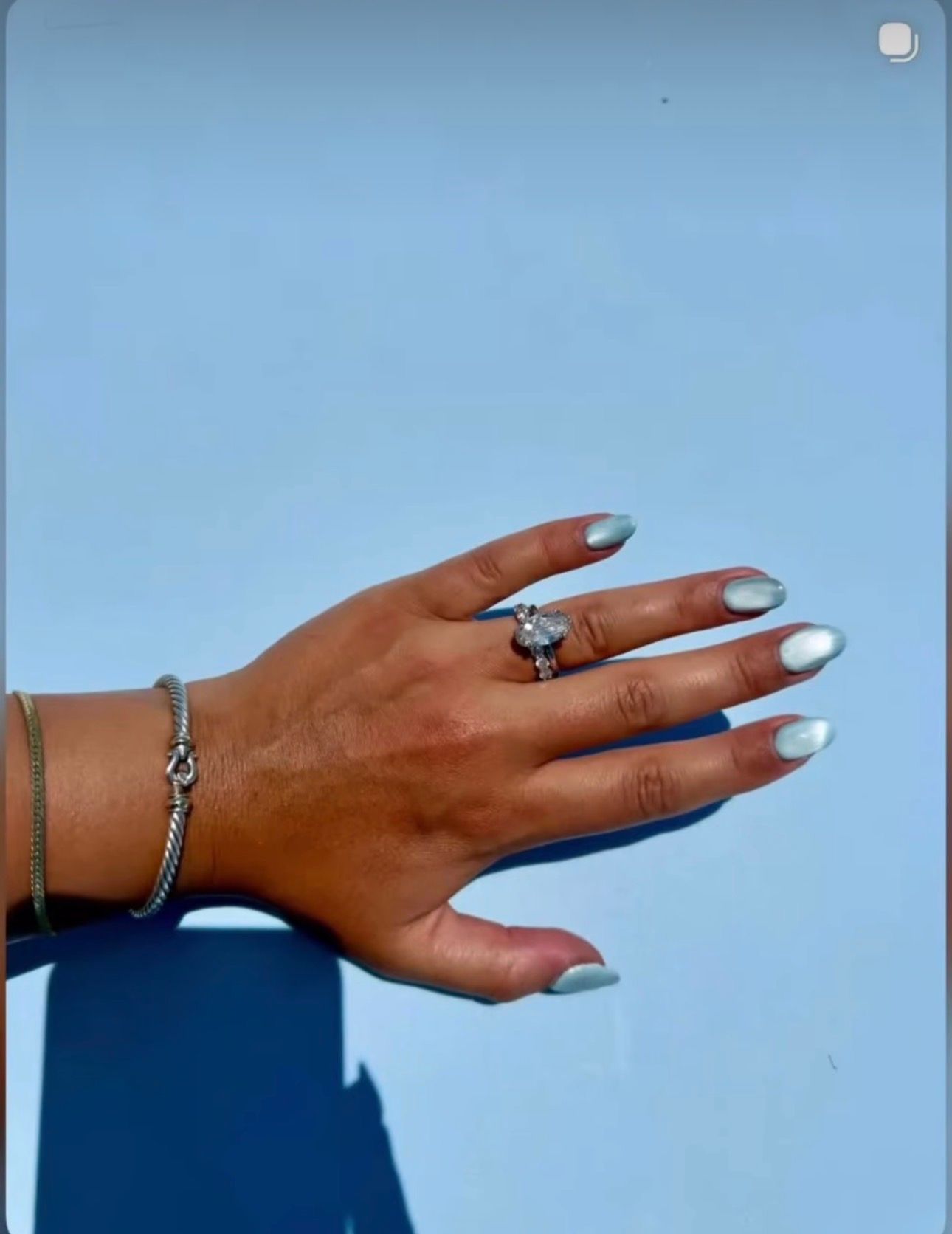 Pale chrome almond nails