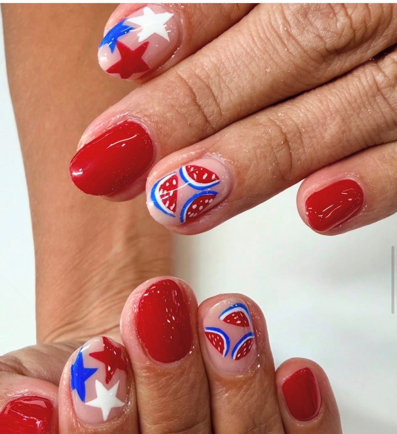 Red nails with star and watermelon art